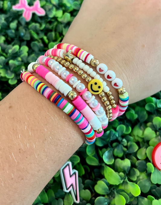 Pink beaded bracelet cluster (6)