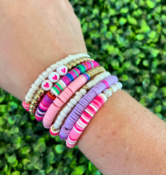 Pink and purple beaded bracelet set (7)