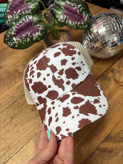 Cross cross cow print ponytail hat