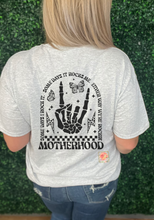 Load image into Gallery viewer, Motherhood, some days I rocket, some days it rocks me front and back tee
